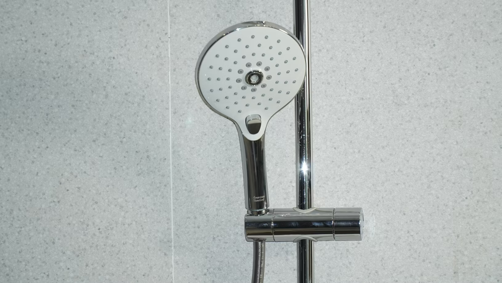 close up of a stainless steel round showerhead