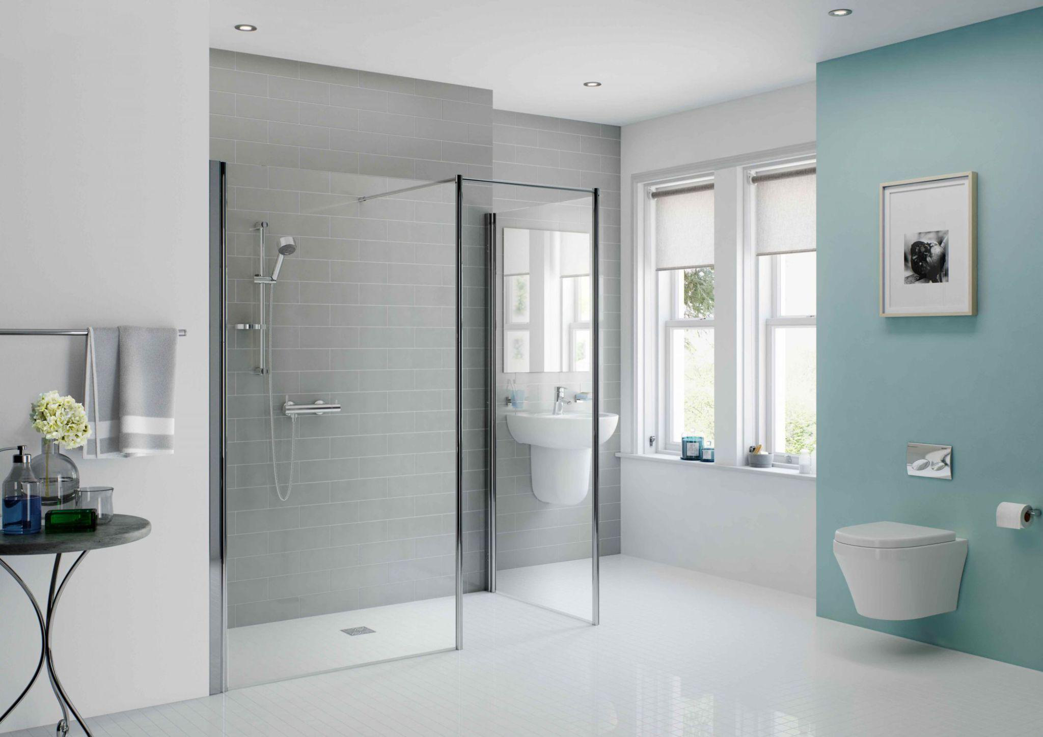 a white and blue bathroom with a walk-in shower
