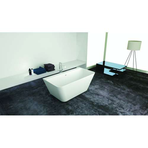 A white rectangular freestanding bathtub in a bathroom with a dark floor