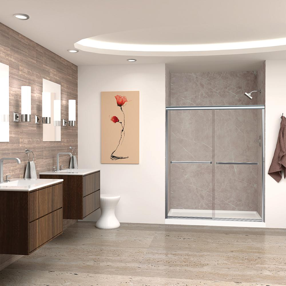 A modern bathroom with accent lighting, marble-walled shower stall, two vanities with mirrors above them, and decorative pieces.