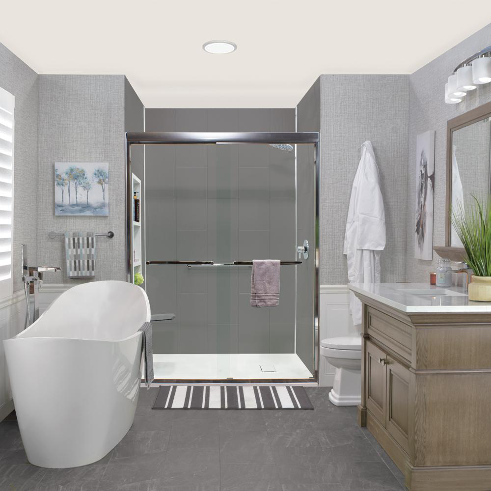 Modern beige-themed bathroom with a shoower stall, white bathtub, woode vanity and sink with a mirror over it.