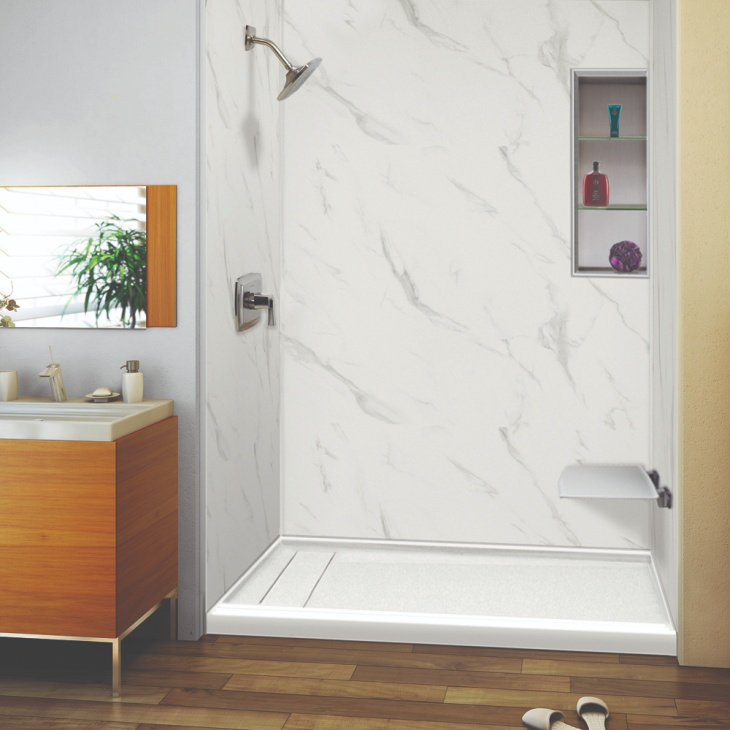 a small walk-in shower in the corner of the bathroom