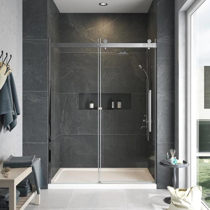 walk-in shower with glass doors against the grey accent wall