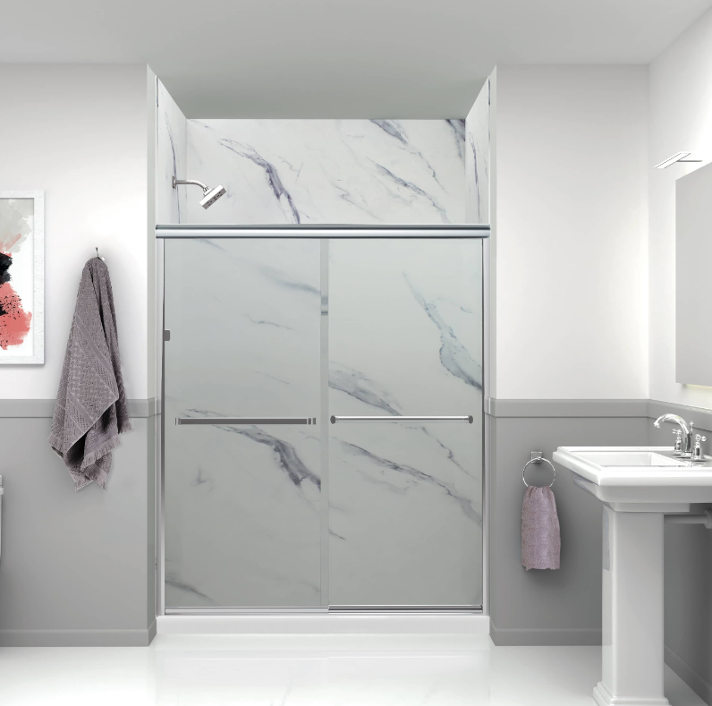 Bathroom with sliding glass shower doors and marble-style wall panels