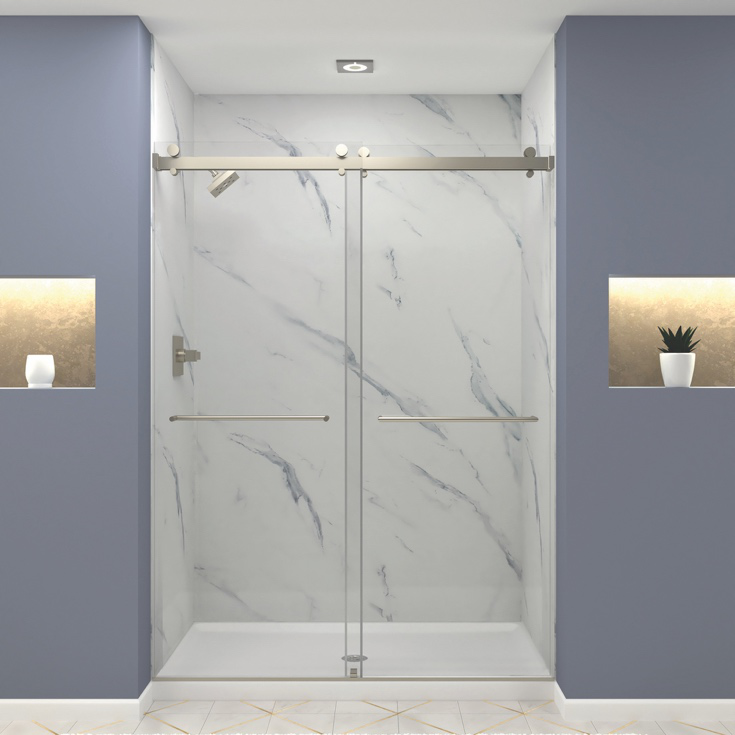 Frameless glass shower with marble-patterned walls and recessed niches