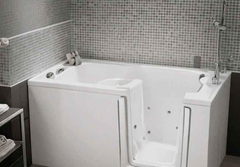 Modern walk-in tub with built-in seat and tiled wall surround