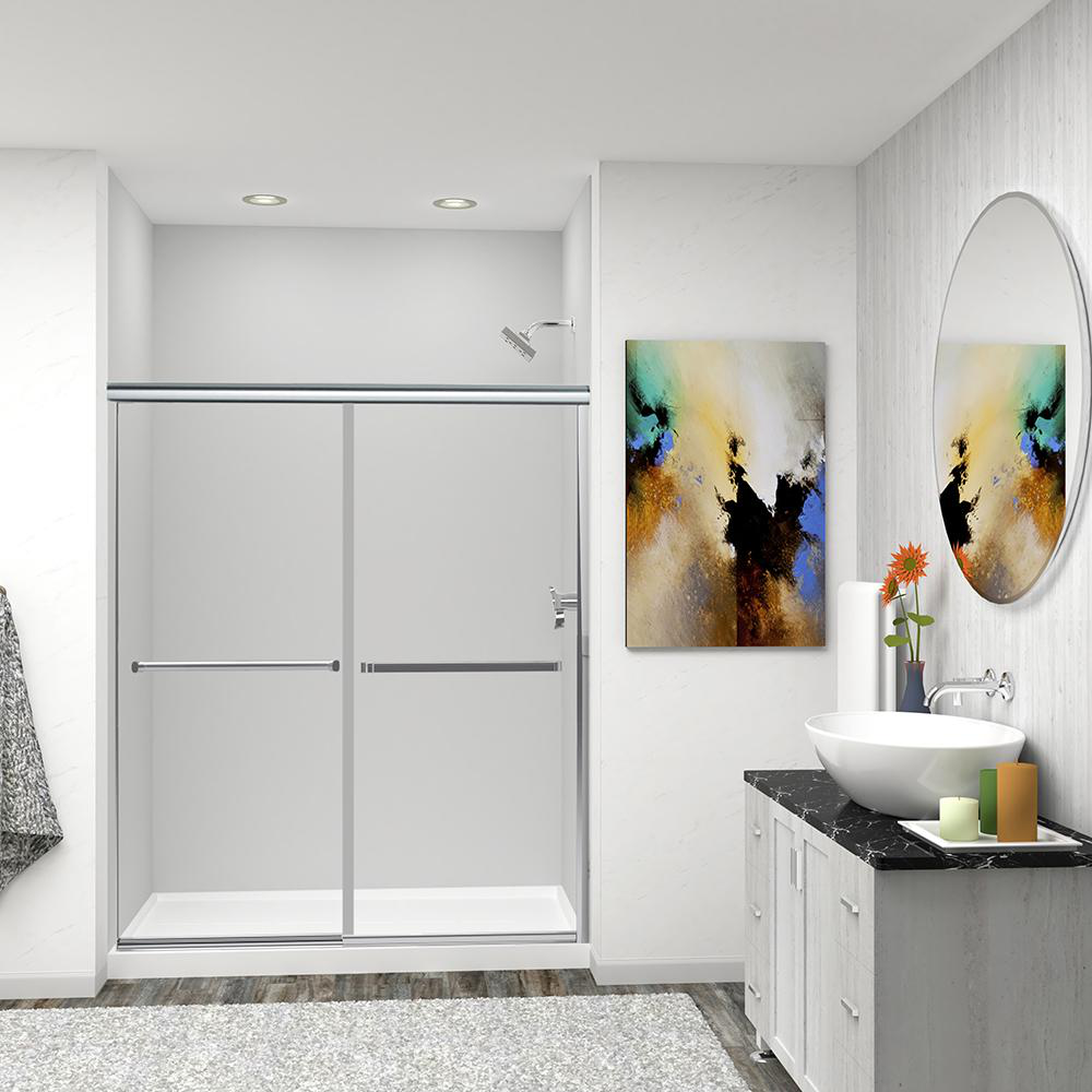 An image of a modern bathroom with a shower stall, round mirror, wash basin, and a painting.