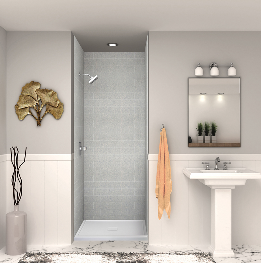 Minimalist bathroom with light gray tile shower, pedestal sink, and gold accent décor for a clean modern look.